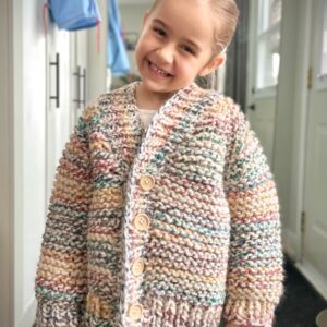 knit cardigan sweater for kids toddler children in saskatoon model wearing pastel rainbow