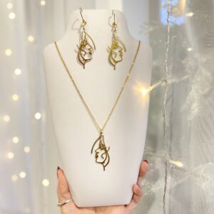 Abstract face jewelry set gold