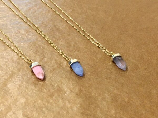 Crystal point necklaces on gold plated chain