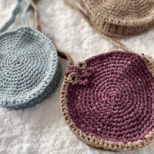 three small round knit purses in blue beige and burgundy for children saskatoon handmade