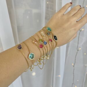 gold bracelets with colourful glass pendant