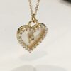 pearl heart shaped necklace in gold