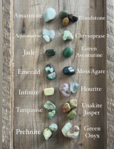 a collection of green tumbled crystals