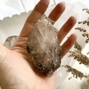 smokey quartz crystals in palm