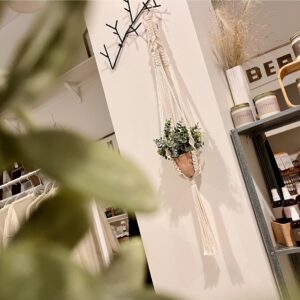 macrame plant hanger with tassel on metal ring