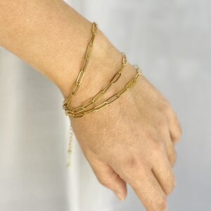 paperclip chain bracelets in gold on model