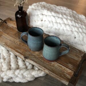 farmhouse cottage core primitive serving tray with metal handles on top of white chunky knit blanket and blue pottery mugs, kitchen decor, living room decor, breakfast in bed, rustic home decor, saskatoon shops