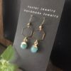 gold hexagon dangly earrings with green gemstone drop saskatoon earrings
