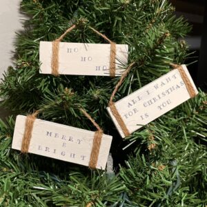 hand stamped christmas ornaments on white with twine, sask made